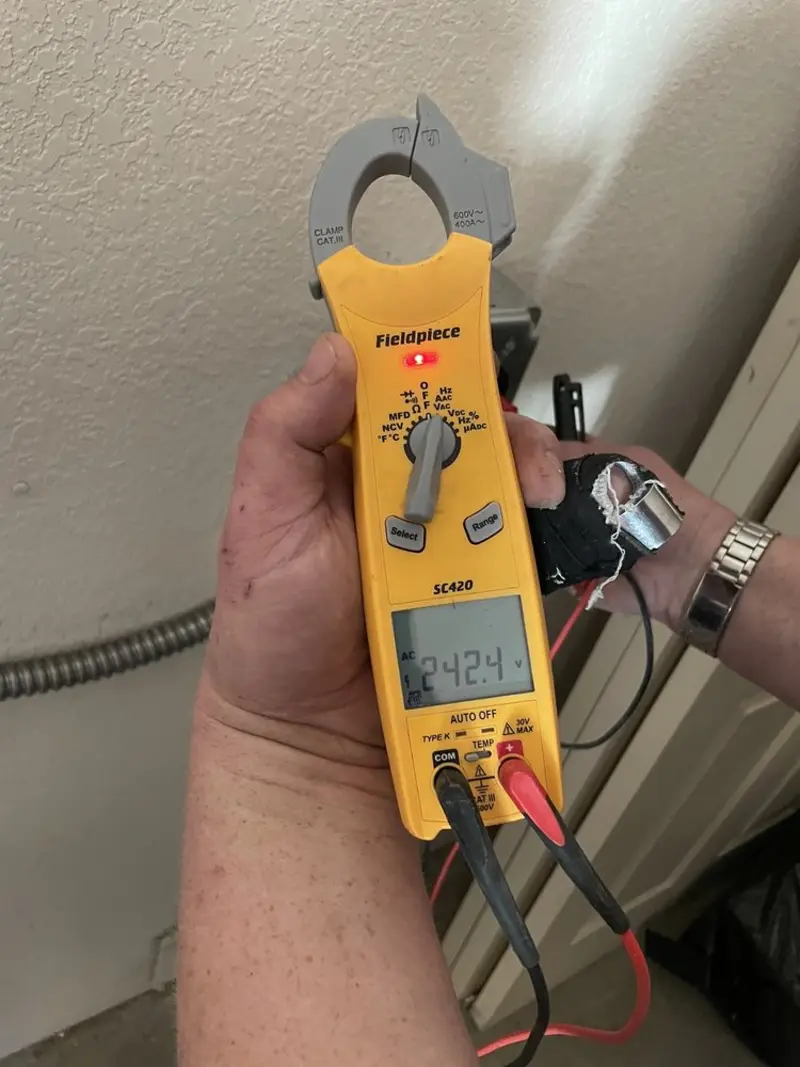 Voltage testing with clamp meter during Recessed Lighting Installation in Country Walk